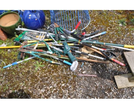 A COLLECTION OF GARDEN TOOLS  including saws, clippers, loppers, etc