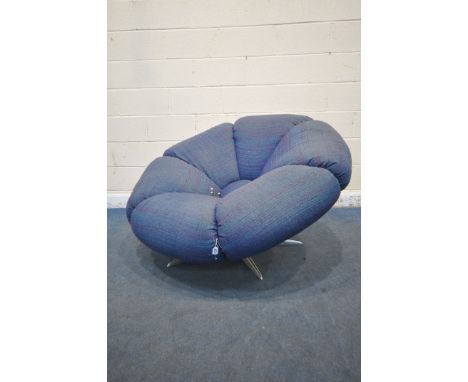 A MID-CENTURY UNBRANDED SWIVEL CHAIR, in the form of a bloomed flower, with purple/blue upholstery, on metal base, width 134c