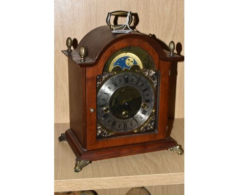 A MODERN FRANZ HERMLE BRACKET CLOCK, Franz Hermle Two Jewel Bracket Clock with Silvered dial and moon phase, Roman numerals a