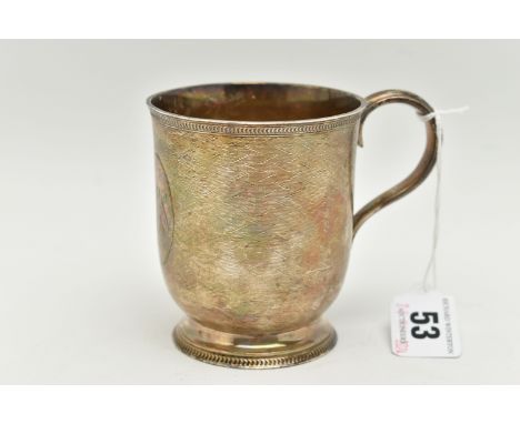 A MID VICTORIAN SILVER CUP, engine turned pattern with engraved oval cartouche, fitted with a scroll handle, gilt interior, h