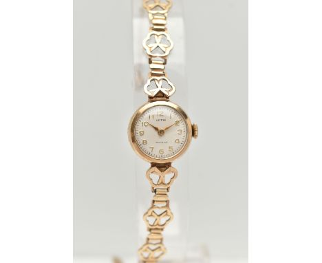 A LADIES 9CT GOLD WRISTWATCH, manual wind, round silver dial signed 'Hefix', Arabic numerals, gold tone hands, in a polished 