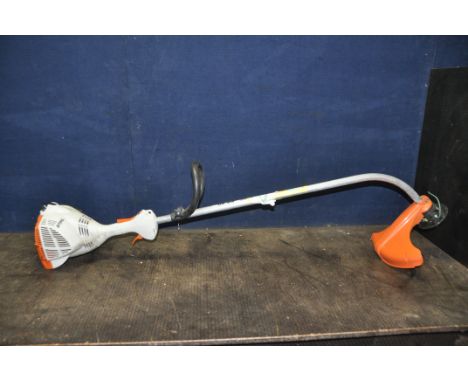 A STIHL FS60 PETROL STRIMMER (engine pulls freely and starts)