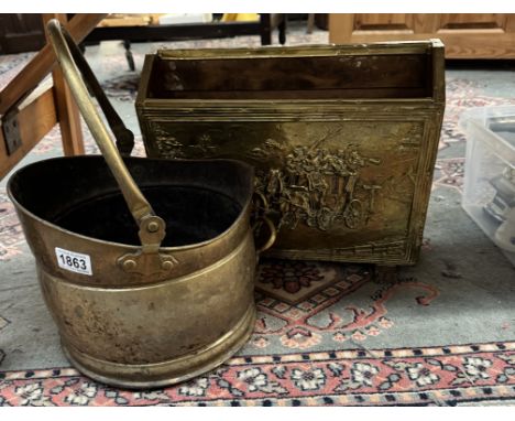 A brass magazine rack and a brass coal scuttle.