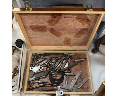 A wooden box of engineering tools including drills, dies &amp; micrometre etc.