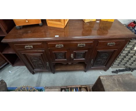 A mahogany sideboard with carved floral panels, 158cm x 52cm x 94cm