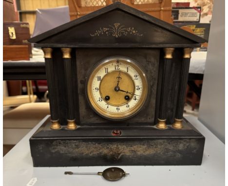 A 19th century black slate Palladian mantle clock