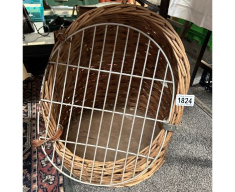 A vintage wicker cat basket