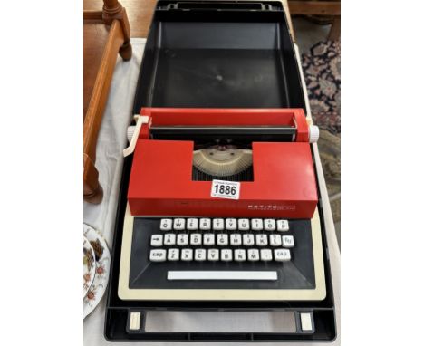 A good cased Petite portable typewriter.