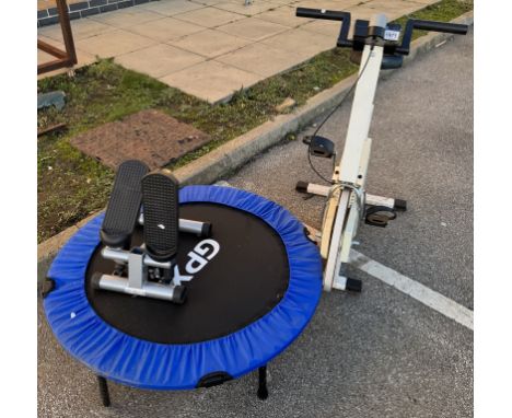 A trampoline, exercise bike &amp; exercise pedals