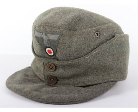 WW2 German Army M-43 Field Cap, good combat worn example of the standard issue field cap worn by the German army during WW2. 