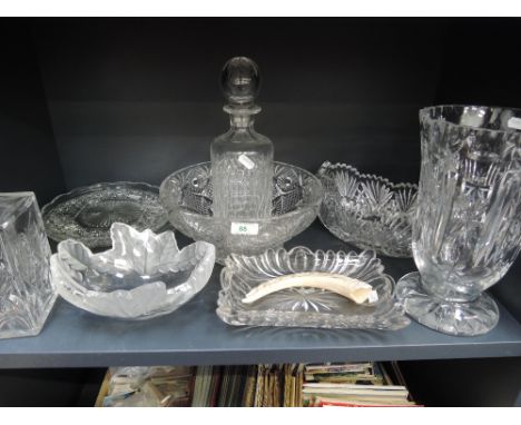 A shelf of cut glass including decanters and bowls etc