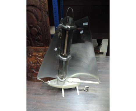 An early 20th century novelty electric fire modelled as a sailing yacht, collectors item only