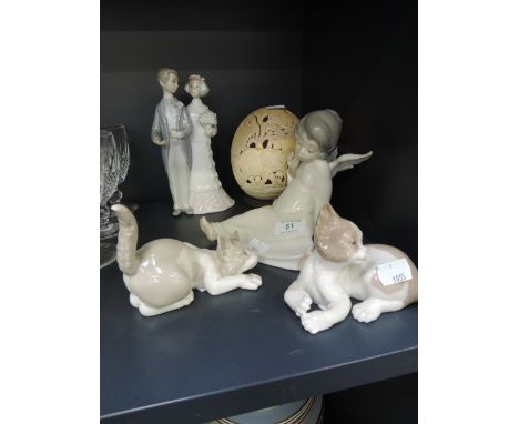 A selection of Lladro including kittens, a seated angel and bride and groom also an ostrich egg