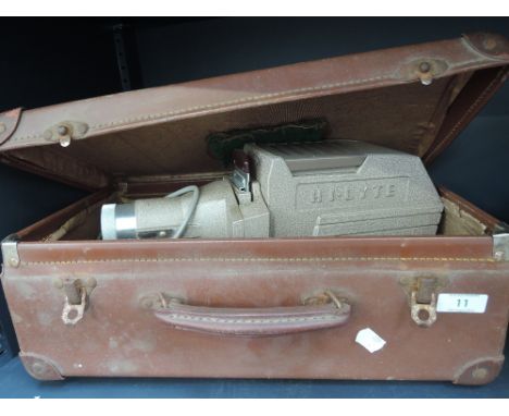 A Hi-Lyte slide projector in vintage travel case