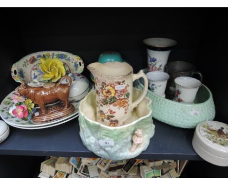 A shelf of ceramics including Sylvac and Masons