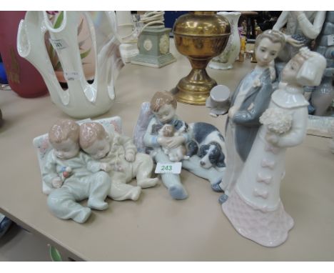 Three Lladro figurines - sleeping children and bride and groom
