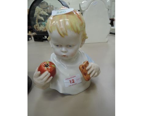 A Metzler Ortloff ceramic ornament modelled as baby in bib with lunch
