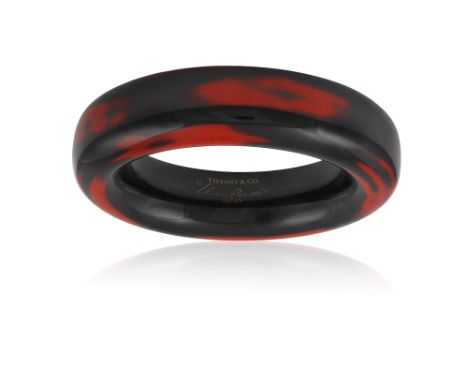A LACQUER BANGLE, BY ELSA PERETTI FOR TIFFANY & CO.The bombé Japanese hardwood bangle with red and black lacquer throughout, 