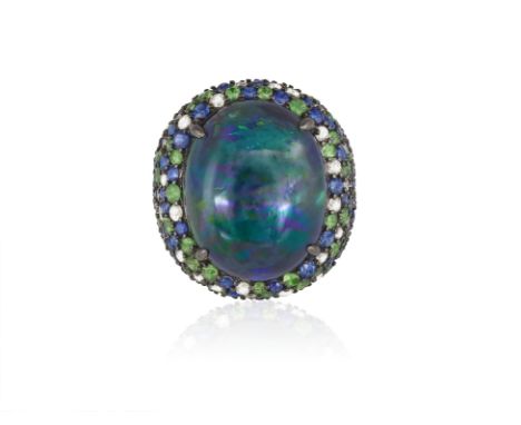 A GEM-SET AND DIAMOND COCKTAIL RINGCentring an oval-shaped opal cabochon weighing approximately 9.50cts, within a surround pa