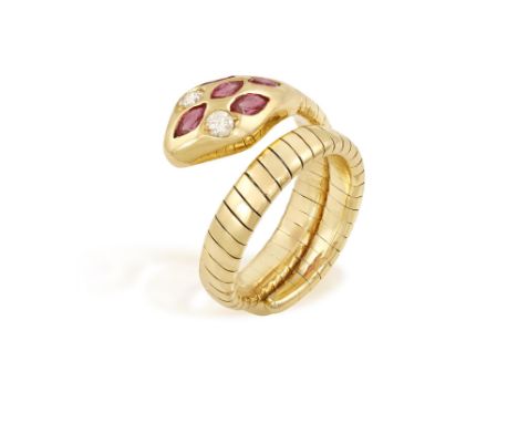 A RUBY AND DIAMOND SNAKE RINGModelled as a serpent, the body composed of a gold sprung gas-pipe link hoop, the head embellish