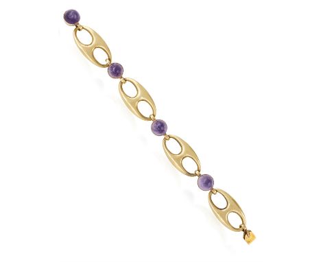 AN AMETHYST AND GOLD BRACELET, CIRCA 1950The fancy gold links interspersed by collet-set cabochon amethysts, mounted in 18K g