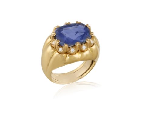 A SAPPHIRE AND DIAMOND COCKTAIL RINGThe cushion-shaped sapphire weighing approximately 7.44cts within a multiple-claw setting