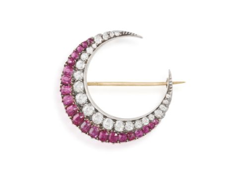 A LATE VICTORIAN RUBY AND DIAMOND BROOCH, CIRCA 1890The crescent set with cushion-shaped rubies, old brilliant and single-cut