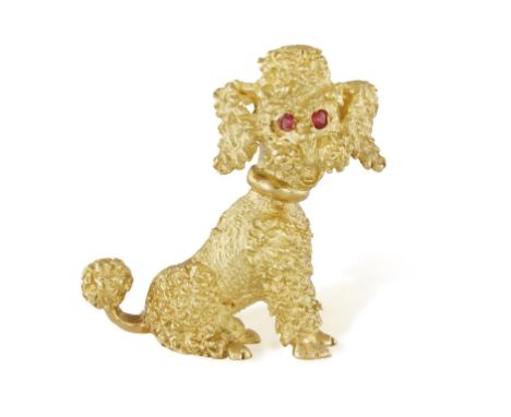 A RUBY & GOLD NOVELTY BROOCH, CIRCA 1970, Modelled as a gold textured poodle with single-cut ruby eyes, mounted in 18K gold, 