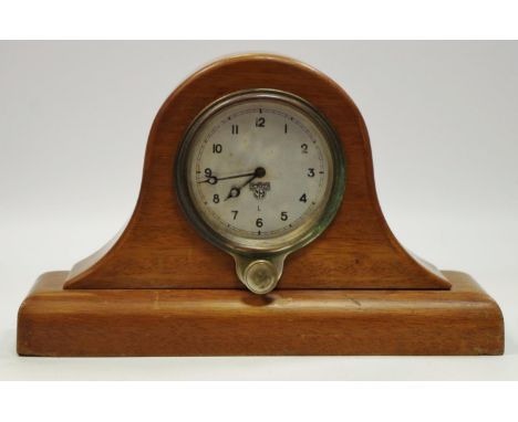A Smiths MA L dashboard clock with front winder/adjuster c.1920/30s, mounted as a mantel clock in a mahogany case