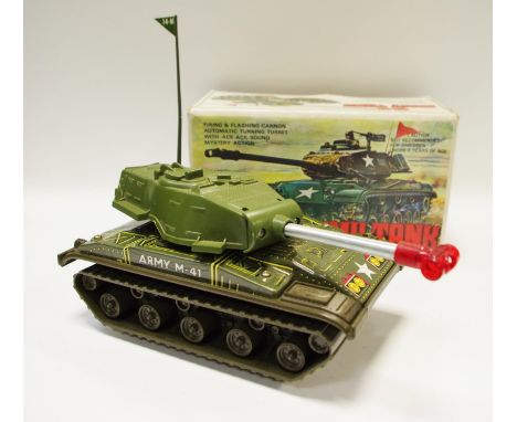 A vintage tin-plate &amp; plastic battery operated M-41 Army Tank, firing &amp; flashing cannon, automatic turning turret, ac