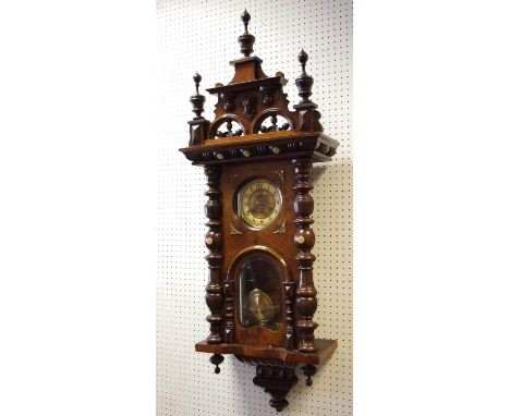 An early 20th century walnut Vienna style wall clock 