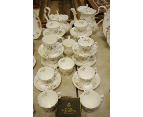 A Royal Albert Howarth pattern part tea service for eight;a coffee pot, two coffee cans and saucers; Royal Doulton Christmas 