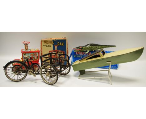 An interesting metal cargo tricycle working model; a tinplate pop-pop boat with heating element c.1950;  Japanese tinplate cl