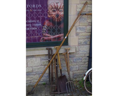Tools - early 20th century gardening tools, including forks, pick axe, shovels, etc 