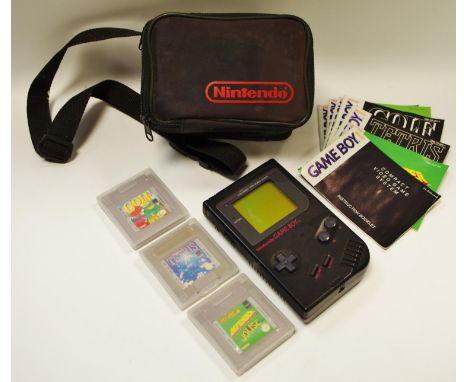 Retro gaming - a Nintendo Gameboy compact video game system, black with instruction booklet; Tetris cartridge with instructio