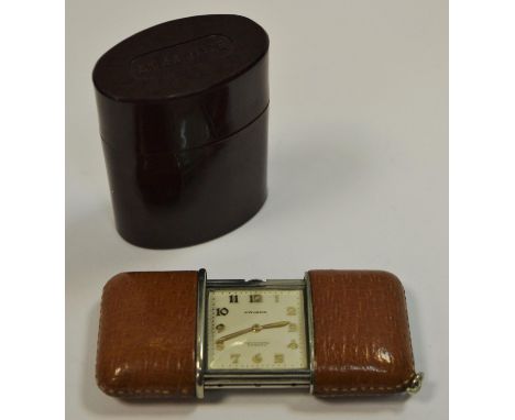 A Movado Ermeto chronometre purse watch, leather casing housed in original Bakelite sleeve 