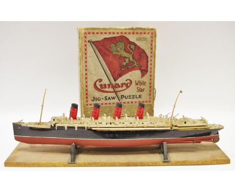 A boxed Chad Valley White Star Jigsaw Puzzle, R.M.S 'Queen Mary'; a scale model of R.M.S. Mauretania, mounted on a wooden pli