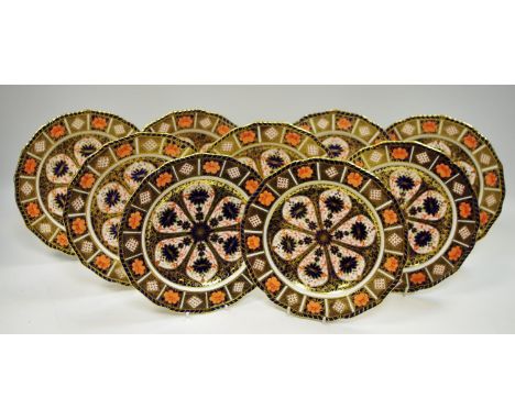 Nine Royal Crown Derby Imari pattern 1126 pattern shaped circular cabinet plates decorated with lappet shaped panels of flowe