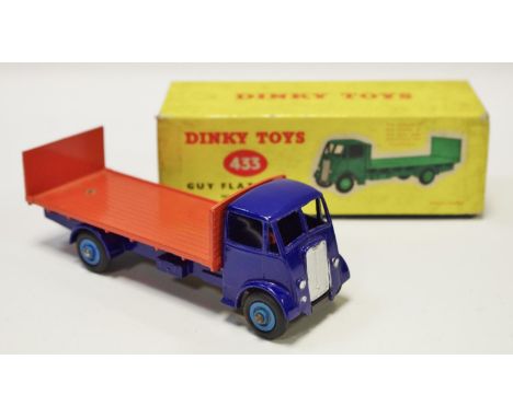 Dinky 433 Guy Flat Truck with Tailboard - blue cab, chassis, orange back, mid-blue Supertoy hubs with black treaded tyres - c