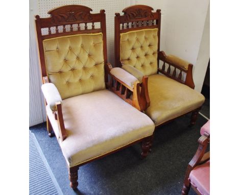 A pair of mahogany fireside chairs, shaped and carved top rail, button upholstered back, spindled arms, padded seat, turned f