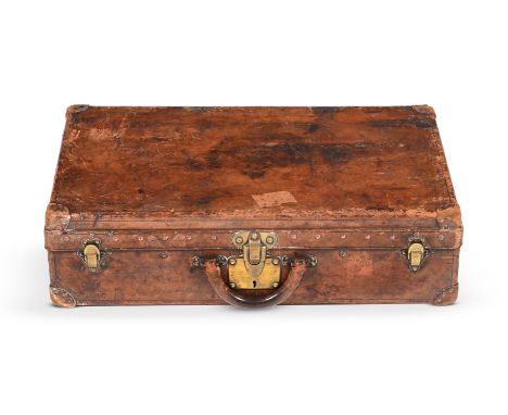 A BROWN LEATHER SUITCASE, NO.213343 LOUIS VUITTON, 20TH CENTURY With studded leather trim, a leather loop handle, brass key a