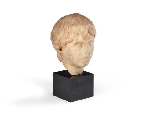 A CARVED MARBLE PORTRAIT HEAD OF A YOUTH, PROBABLY POLIDEUCE  ROMAN, POSSIBLY CIRCA 170-177 AD  Now set on brass stem and met