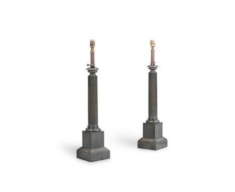 A PAIR OF FRENCH BRONZED METAL COLUMN FORM OIL LAMPS  LATE 19TH/EARLY 20TH CENTURY AND LATER FITTED FOR ELECTRICITY  Each wit