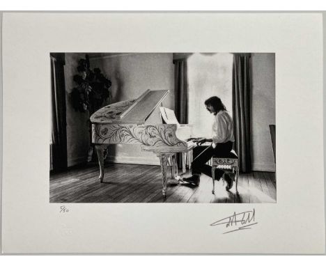 A high-quality photo print depicting Jon Lord of Deep Purple, taken by photographer Martyn Goddard in 1982. Measures 12 x 16"