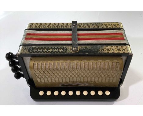 A Hohner Vienna 114 accordion. It outputs sound however, the melody buttons didn't appear to work. The accordion shows signs 