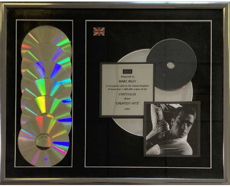 A framed official BPI CD presentation award, presented to Marc Riley to recognise 1,800,000 sales of Robbie Williams' 'Greate
