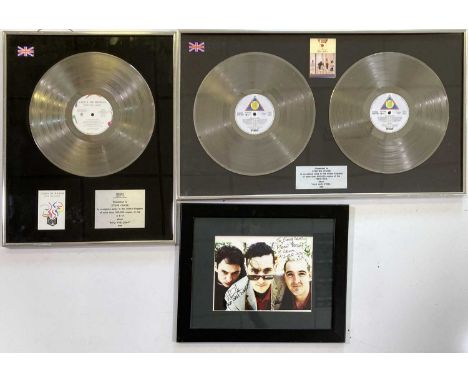 A silver BPI presentation disc recognising 300,000 sales of Chris De Burgh - Into The Light (16 x 20"), an award recognising 