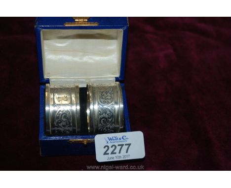 A pair of boxed Silver napkin Rings engraved "R", marked Birmingham 1930