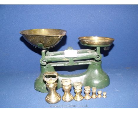 A good vintage set of scales with brass weights.