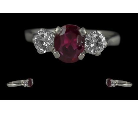 Ladies Pleasing Quality Platinum Three Stone Ruby and Diamond Set Ring, marked for platinum to the shank, the centre ruby of 